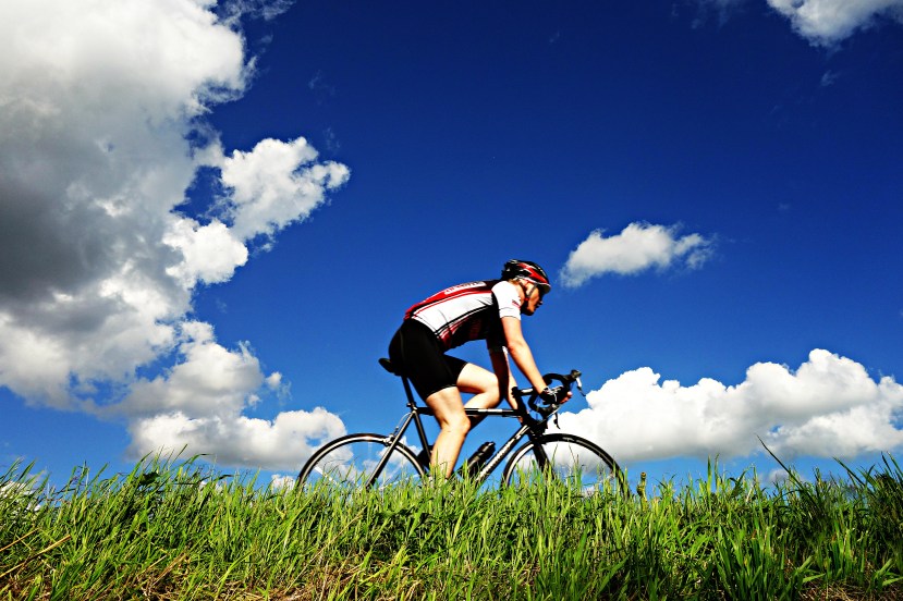 cyclist-riding-under-blue-skies.jpg
